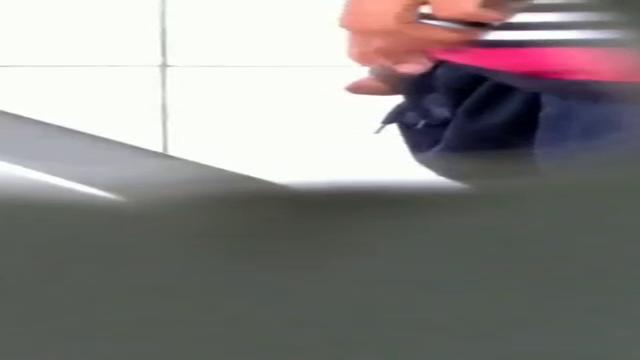 Brazilian men pissing at bathroom