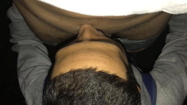 sucking the plump cock in the bush.