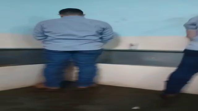 Brazilian men pissing at bathroom