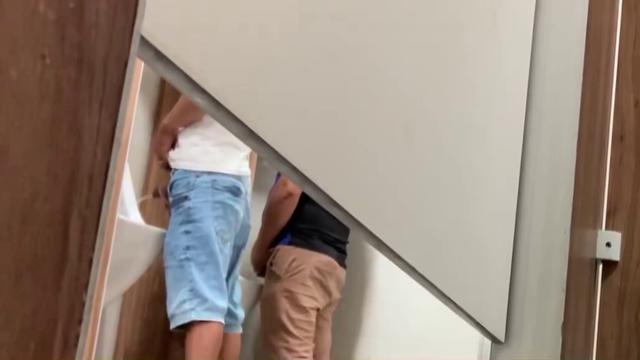 Brazilian men pissing at bathroom