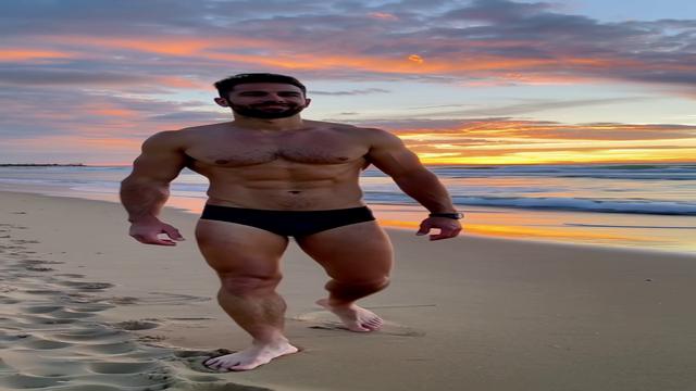 MUSCULAR MAN ON THE BEACH 1