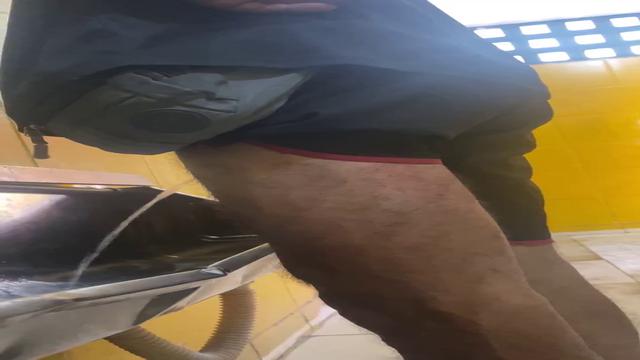Brazilian men pissing at bathroom