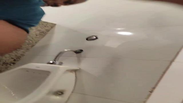 Brazilian men pissing at bathroom