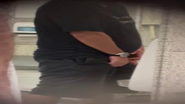Brazilian men pissing at bathroom