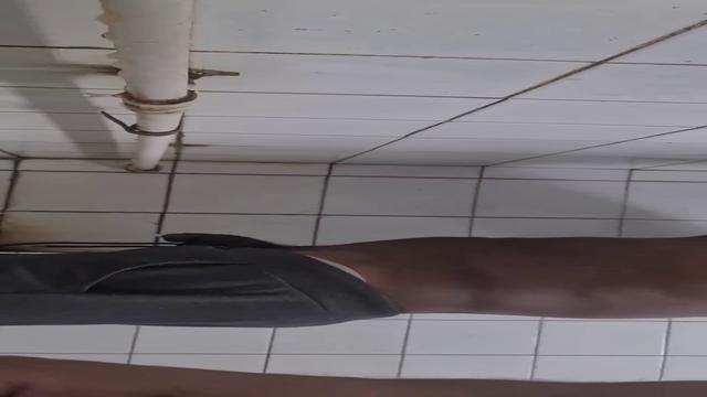 Brazilian men pissing in bathroom