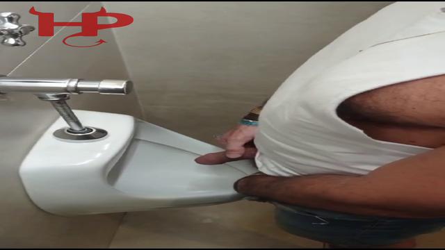 Pissing in the bathroom at the Paraguay Shopping Mal...